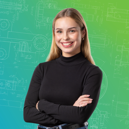 A blonde woman smiling at the camera, wearing a black sweater and standing in front of a green background
