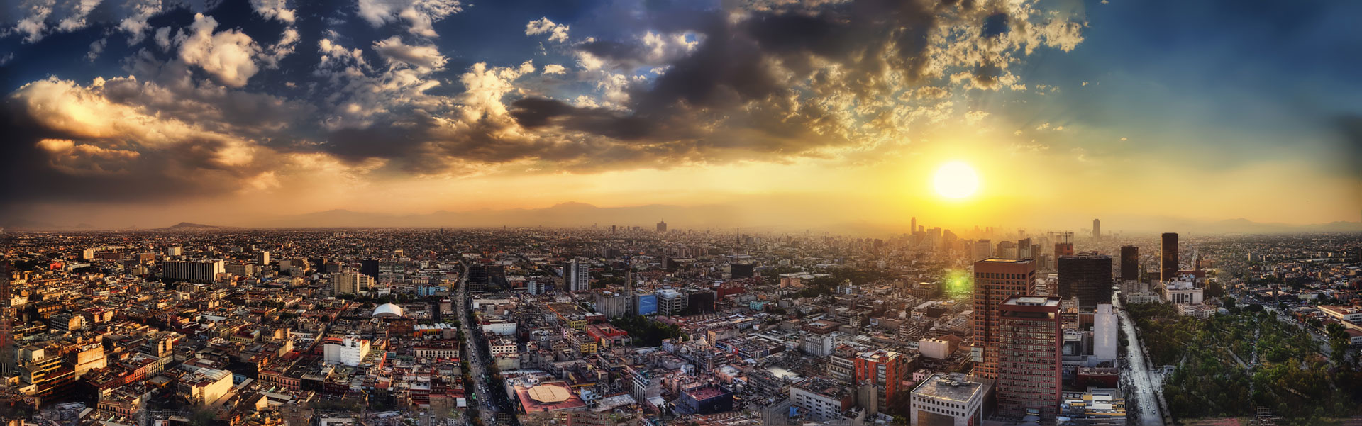 Photo showing an overview shot a Mexican city at sunset.