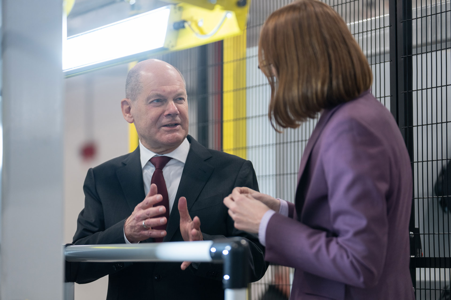 Picture shows a man and a woman talking to each other
