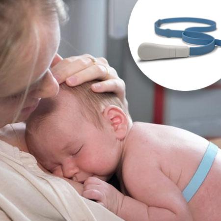 Photo shows a baby wearing a blue silicone belt on its upper body and being stroked on the head by its mother.