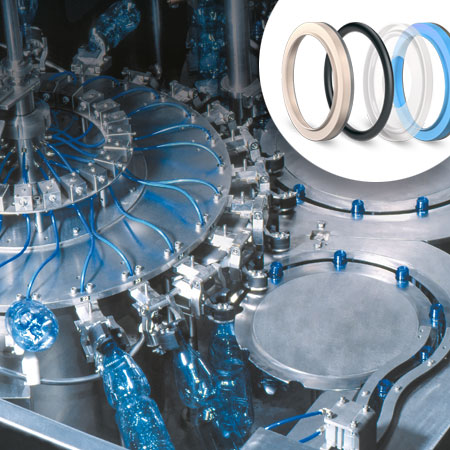 Image of a bottle filling machine with sealing rings in the right corner of the photo