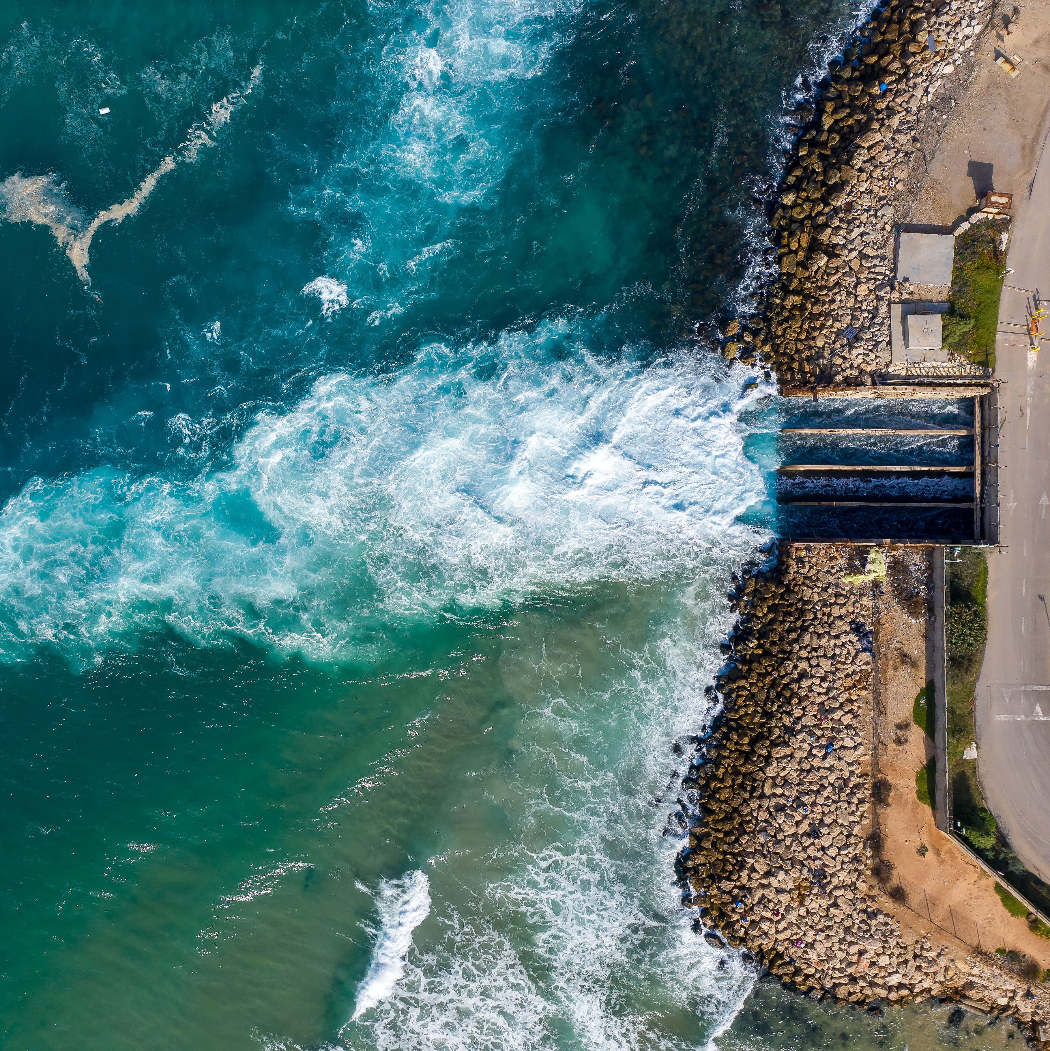 Water flowing out of a water gate into the sea