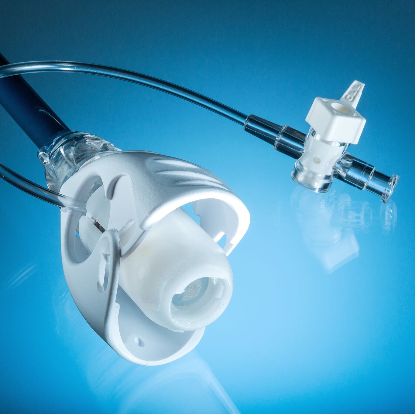 Photo shows a catheter by Freudenberg Medical on blue background
