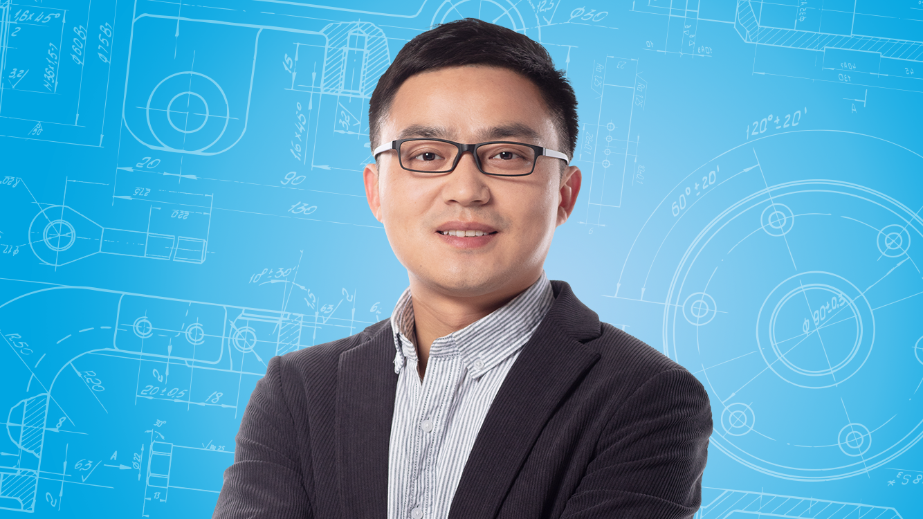 Portrait of a male person shown in the center of the picture against a blue background.