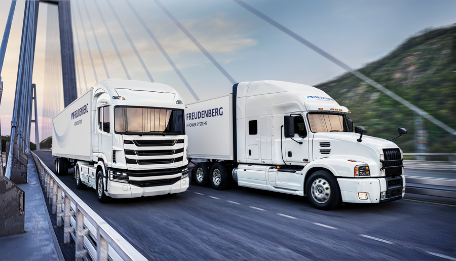 A bus and a truck driving on a bridge