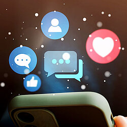 Various icons and a phone below them