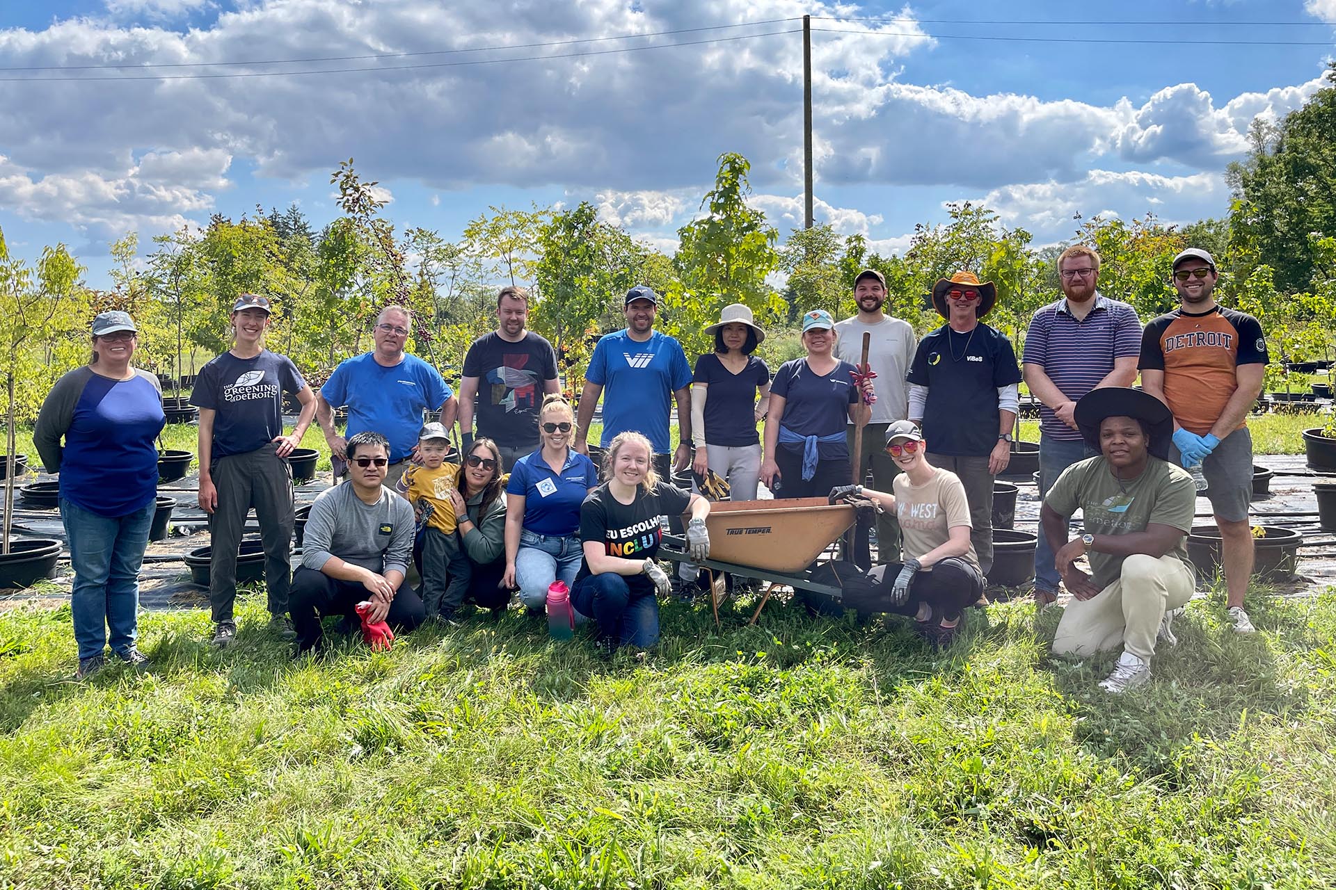 Group of Freudenberg employee volunteers in front of replanted trees