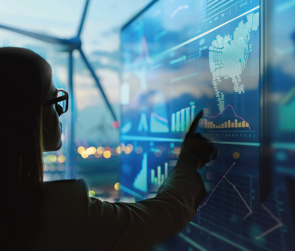 Young woman in front of a screen with graphs and charts